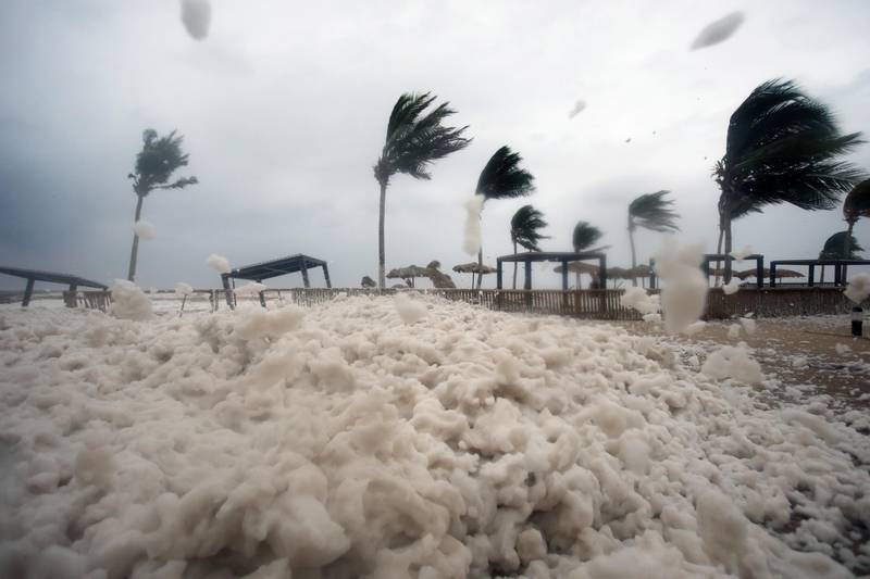 Debris and sea foam litters a beach during Cyclone Mekunu in Salalah, Oman, May 26, 2018. Cyclone Mekunu blew into the Arabian Peninsula early Saturday, drenching arid Oman and Yemen with rain, cutting off power lines, officials said. Kamran Jebreili / AP Photo