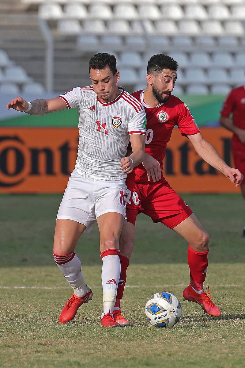 UAE's Caio Canedo and Rabih Ataya battle for the ball. AFP