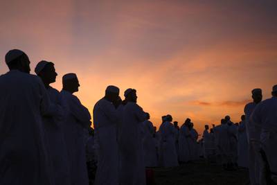 Samaritans worshippers gather to pray at sunrise during a Passover ceremony on top of Mount Gerizim, near the northern West Bank town of Nablus. AFP