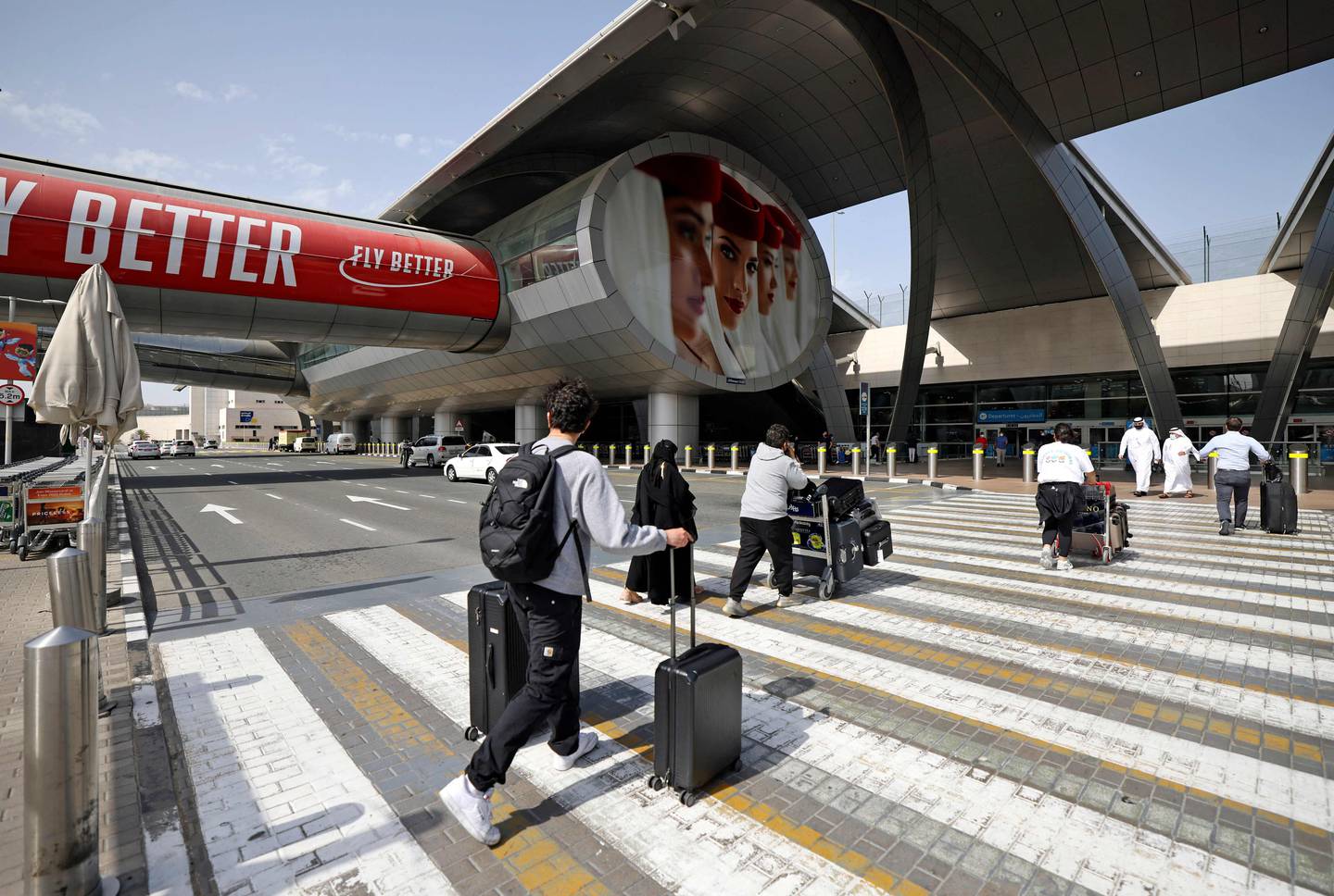 Travellers outside Dubai International Airport on February 21, 2022. Karim Sahib / AFP