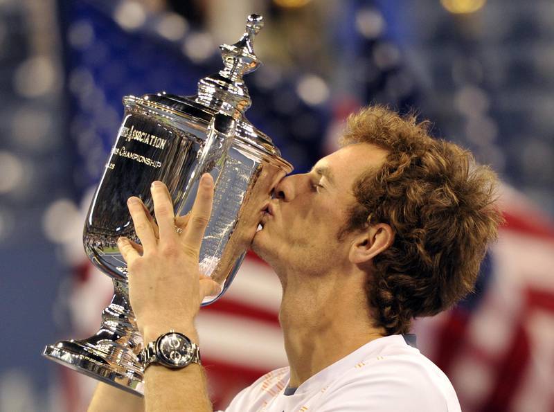 (FILES) In this file photo taken on September 11, 2012 Andy Murray of Great Britain (3)  with trophy after he wins against Novak Djokovic  of Serbia (2) during their 2012 US Open men's singles finals match at the USTA Billie Jean King National Tennis Center in New York on September 10, 2012.    AFP PHOTO / TIMOTHY A. CLARY - Reaching world number one in an era of Roger Federer, Novak Djokovic and Rafael Nadal speaks volumes about the drive of Andy Murray, who took up the game as a three-year-old. But at 31, excruciating pain from a hip injury is drawing the curtain on a professional career that spanned 14 years and ended a decades-long drought for British tennis.  A tearful Andy Murray on January 11, 2019 announced he would likely retire this year due to severe pain from a hip injury, saying next week's Australian Open could be the last tournament of a glittering career. (Photo by Timothy A. CLARY / AFP)