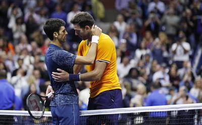 epa07009353 Novak Djokovic of Serbia (L) and Juan Martin del Potro of Argentina at the net after the men's final on the fourteenth day of the US Open Tennis Championships the USTA National Tennis Center in Flushing Meadows, New York, USA, 09 September 2018. The US Open runs from 27 August through 09 September.  EPA/JUSTIN LANE *** Local Caption *** 53000073