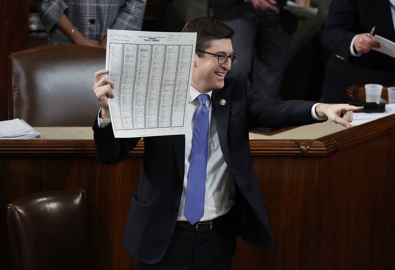 Bryan Steil, a Republican, holds up a tally sheet as Kevin McCarthy was eventually elected Speaker of the House. AFP