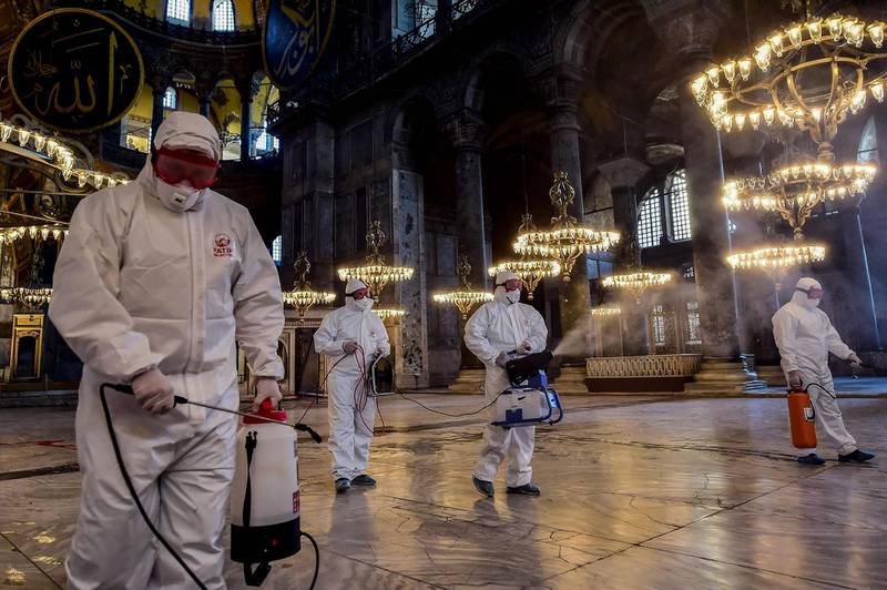 Employees of the Fatih Municipality disinfect the Hagia Sophia to prevent the spread of the COVID-19, caused by the novel coronavirus, in Istanbul. AFP