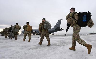 Airmen and soldiers from the Alaska National Guard prepare to depart from Joint Base Elmendorf-Richardson, Alaska, to assist with the inauguration of President-elect Joe Biden in Washington. AP