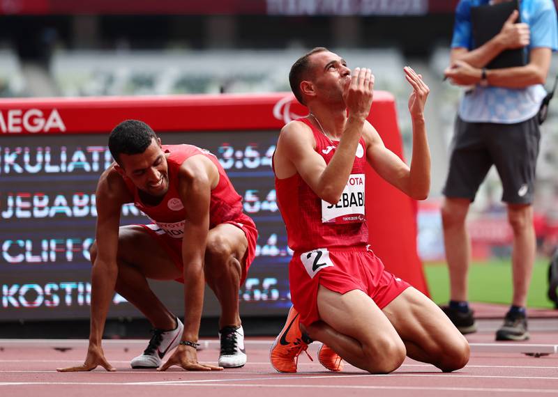 Tokyo 2020 Paralympic Games - Athletics - Men's 1500m - T13 Final - Olympic Stadium, Tokyo, Japan - August 31, 2021.  Rouay Jebabli of Tunisia reacts after winning silver REUTERS / Athit Perawongmetha