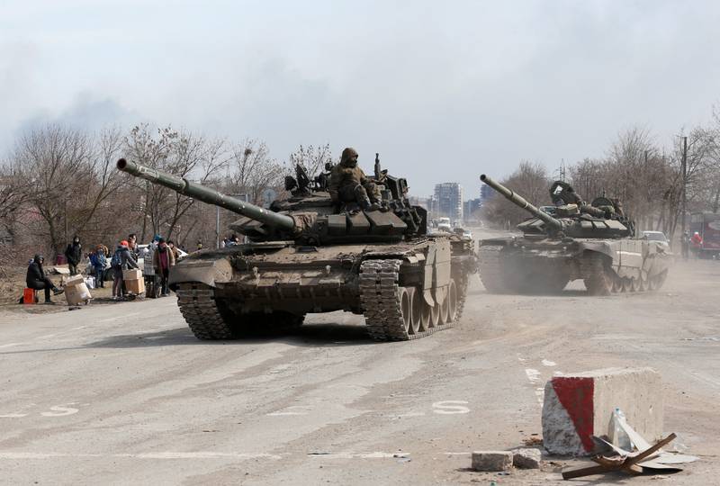 Pro-Russia militia fighters travel by tank to the outskirts of Mariupol. Reuters