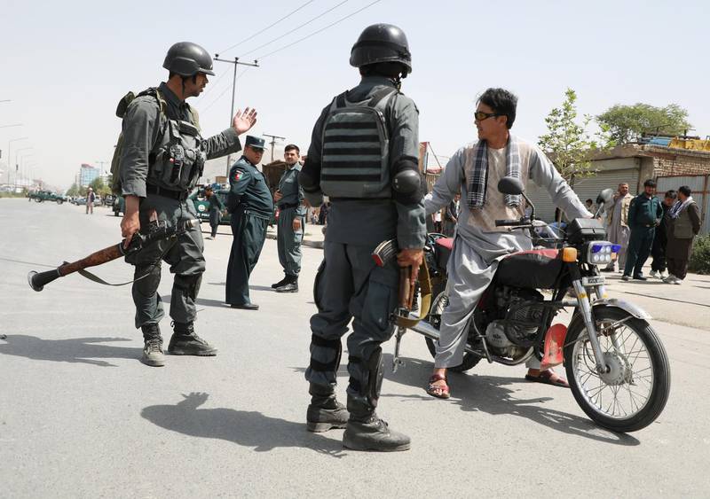 Afghan police officers secure the site of a car bomb blast in Kabul, Afghanistan, August 7, 2019. REUTERS/Omar Sobhani