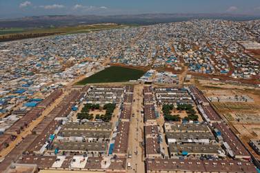 A large refugee camp on the Syrian side of the border with Turkey, near the town of Atma, in Idlib province, Syria. AP Photo