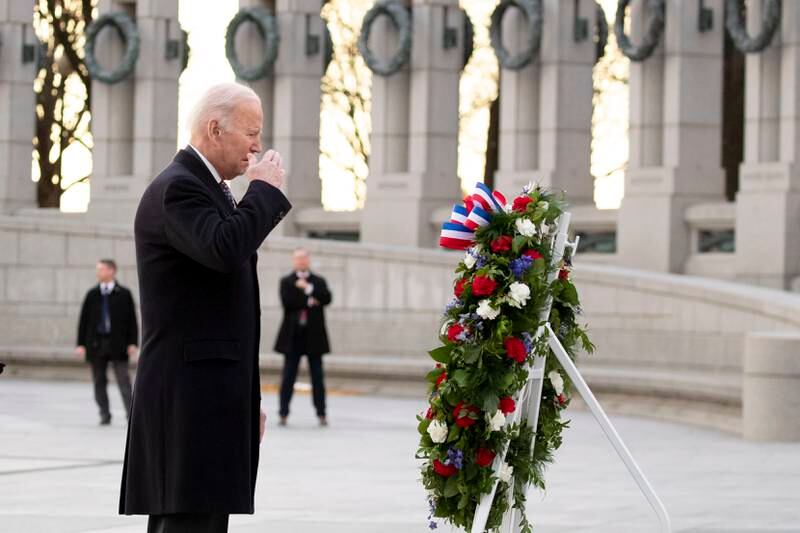 US President Joe Biden salutes while participating in a wreath-laying ceremony as he visits the World War II Memorial on the 80th anniversary of the attack on Pearl Harbour. EPA