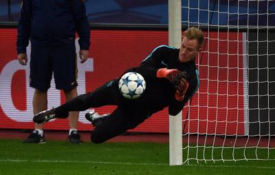 Barcelona keeper Marc-Andre ter Stegen makes a save on Tuesday during training. Patrik Stollarz / AFP