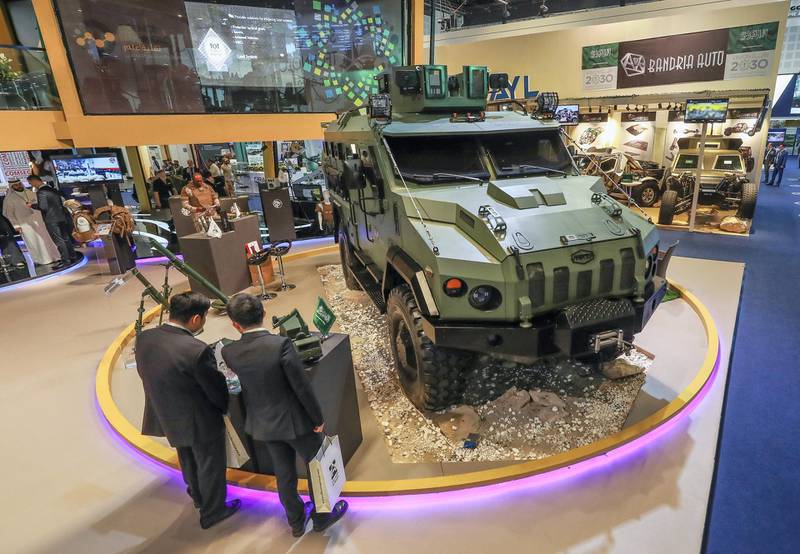 Abu Dhabi, U.A.E., February 20, 2019. INTERNATIONAL DEFENCE EXHIBITION AND CONFERENCE  2019 (IDEX) Day 4--  Visitors look at the military vehicles at the Saudi Arabia area stands..Victor Besa/The NationalSection:  NA