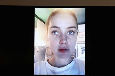 Evidence showing pictures of US actress Amber Heard appear on a screen during a defamation trial. AFP