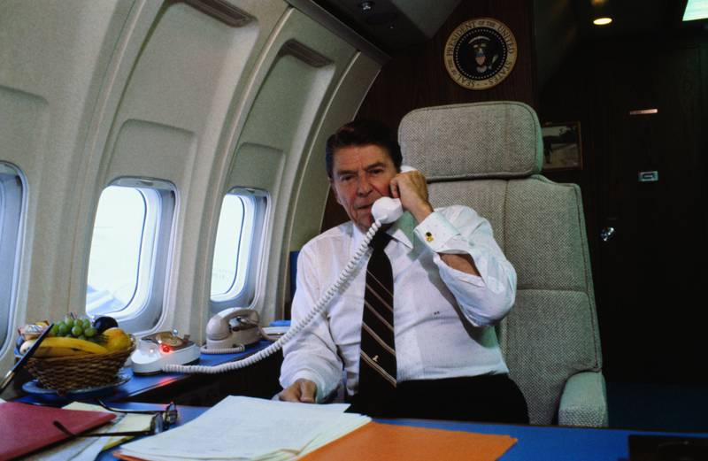 Reagan talks on the telephone while flying on Air Force One. Photo: Bettmann