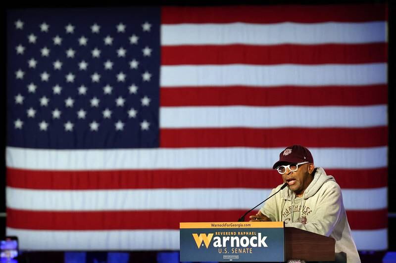 Director Spike Lee speaks to the crowd at Mr Warnock's watch party. Getty / AFP