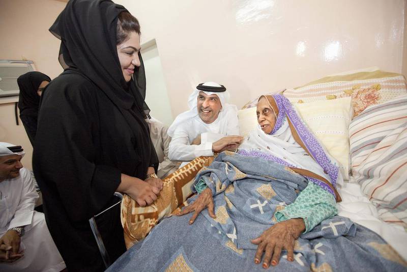 Representatives from the Community Development Authority visit an elderly woman at her home in Dubai. Long-term care for the elderly will be a policy challenge in many countries. Jaime Puebla / The National