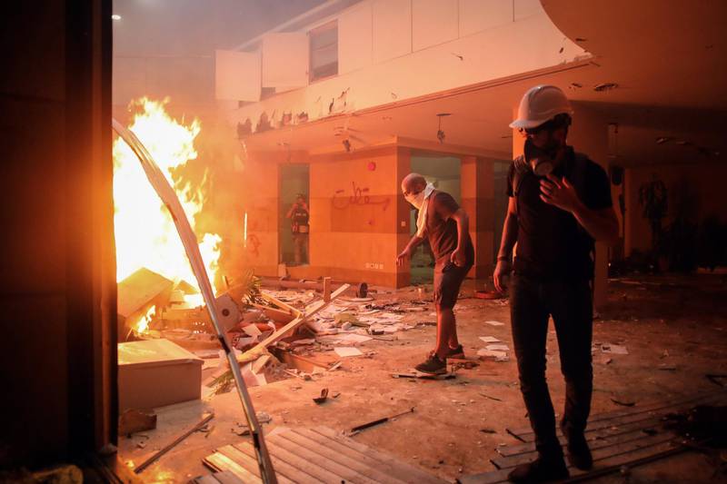 Protesters light fires inside the Lebanese Banks Association (ABL) headquarters during a demonstration. Bloomberg