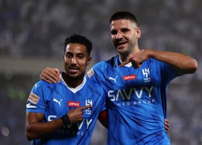 Aleksandar Mitrovic celebrates with Salem Al Dawsari after scoring for Al Hila. Getty