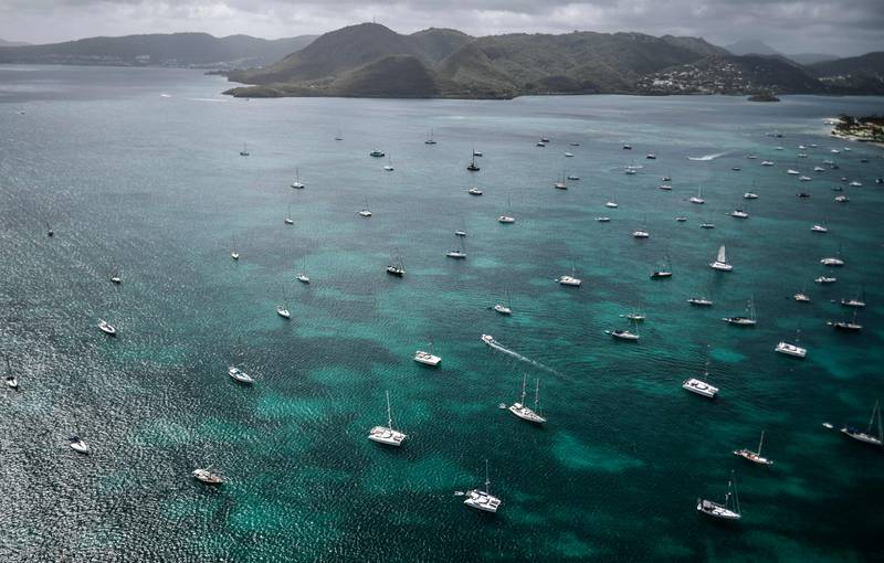 The coast of the French Caribbean island of Martinique is dotted with sailing boats. AFP