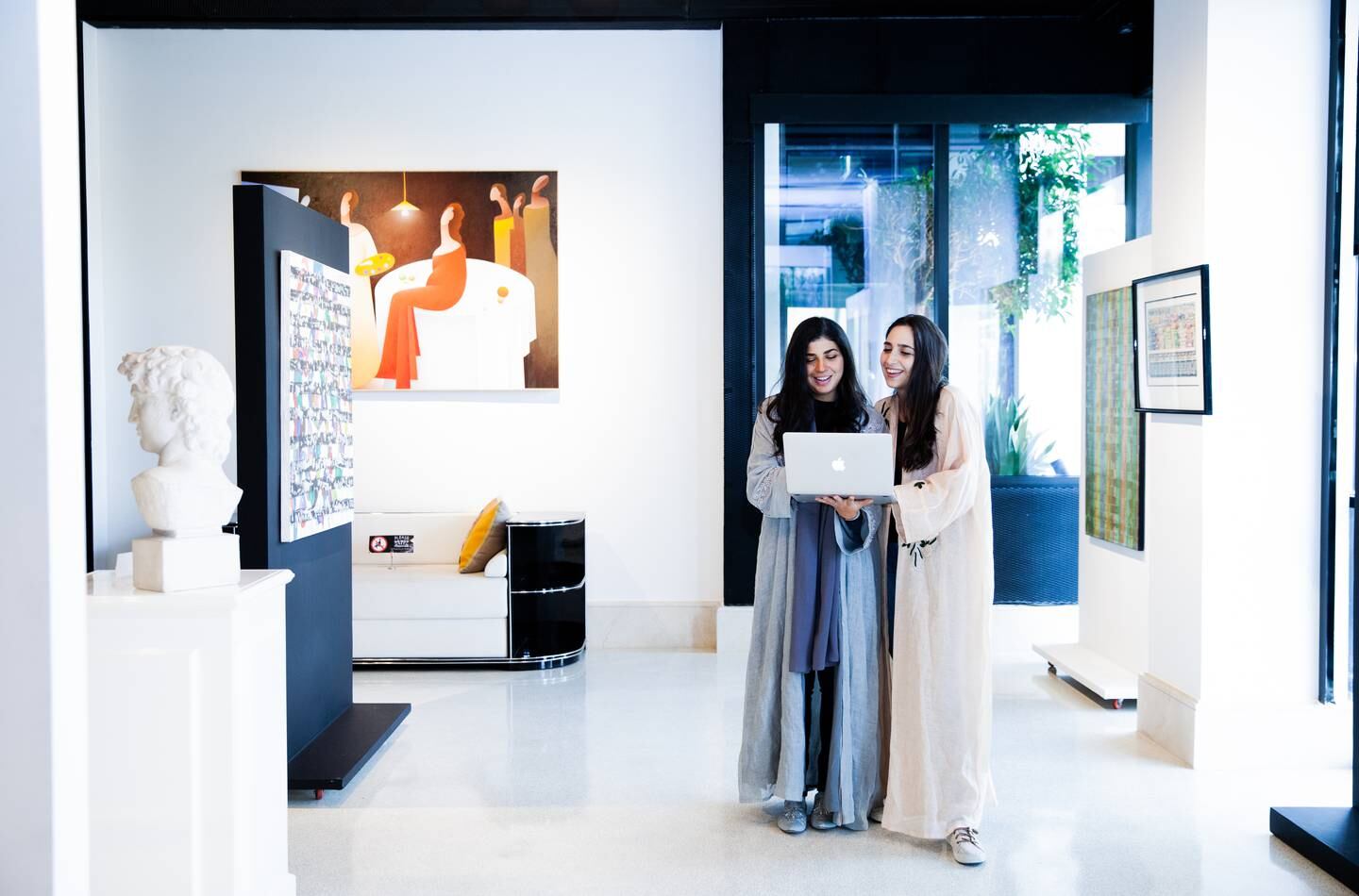 Noura (L) and Basma Bouzo, founders of Saudi Design Week, pictured in an art gallery in Riyadh. Photo: Bayan Alsadiq