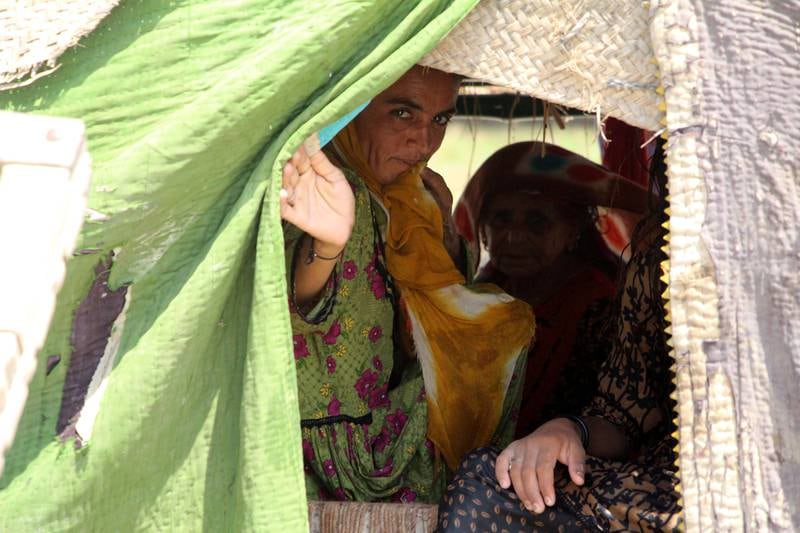 People affected by floods wait for relief in Dadu district, Sindh province. EPA