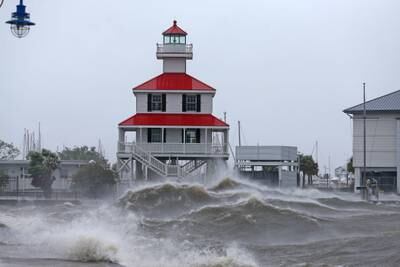 Waves crash against the New Canal Lighthouse on Lake Pontchartrain. Reuters