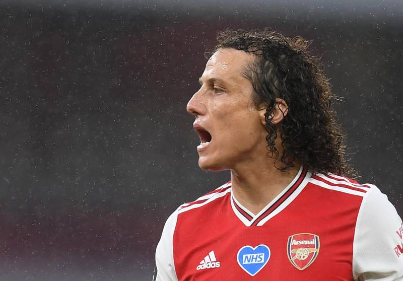 David Luiz - 7: At the heart of Arsenal's late rearguard effort. Reuters