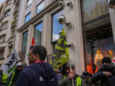 French pension protesters storm LVMH luxury shop
