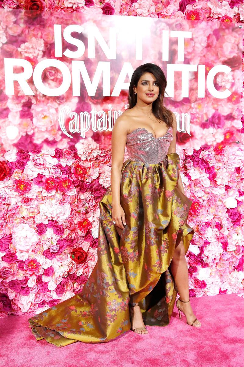 Chopra's strapless pink and gold Vivienne Westwood gown matched the pink carpet. EPA