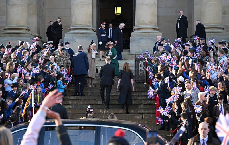 The king and Queen Consort Camilla arrive at Bolton Town Hall. AFP