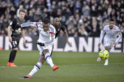 Alexandre Lacazette attracted interest from a host of clubs before committing his future to Lyon. Jeff Pachoud / AFP