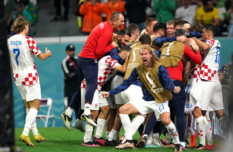 Croatia's Bruno Petkovic is mobbed by teammates after scoring. PA