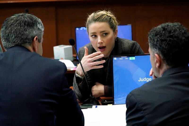 US actress Amber Heard with her attorneys in the courtroom. EPA