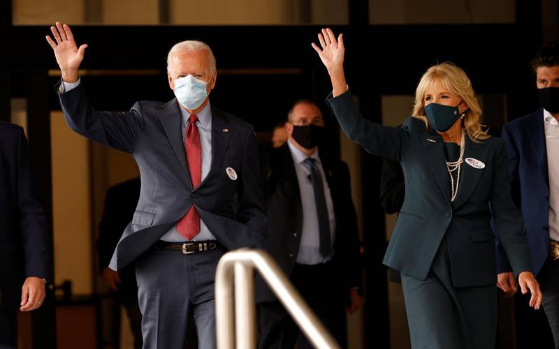 Democratic U.S. presidential nominee and former Vice President Joe Biden and his wife Jill wave as they depart after casting their votes in the 2020 U.S. presidential election in Wilmington, Delaware, Reuters