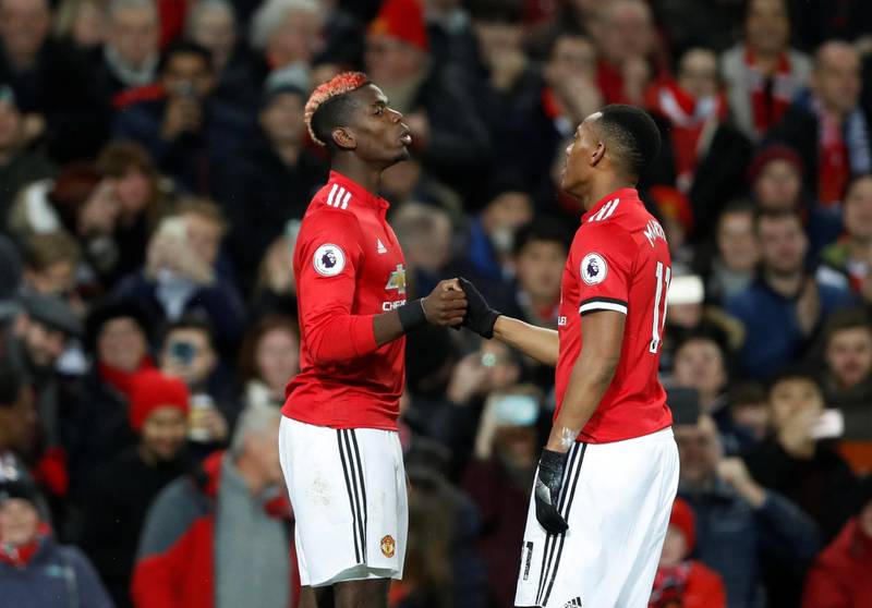 Soccer Football - Premier League - Manchester United vs Newcastle United - Old Trafford, Manchester, Britain - November 18, 2017   Manchester United's Paul Pogba celebrates with Anthony Martial after scoring their third goal    Action Images via Reuters/Carl Recine    EDITORIAL USE ONLY. No use with unauthorized audio, video, data, fixture lists, club/league logos or "live" services. Online in-match use limited to 75 images, no video emulation. No use in betting, games or single club/league/player publications. Please contact your account representative for further details.