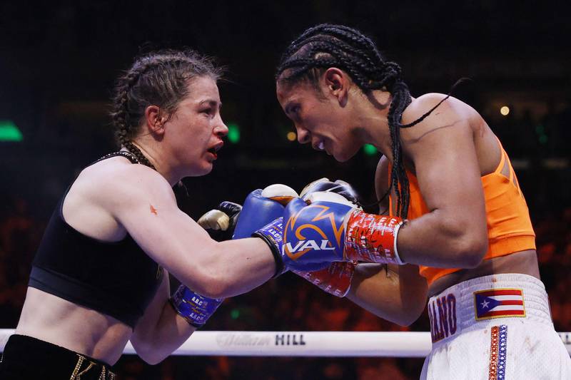 Katie Taylor trades punches with Amanda Serrano. Getty