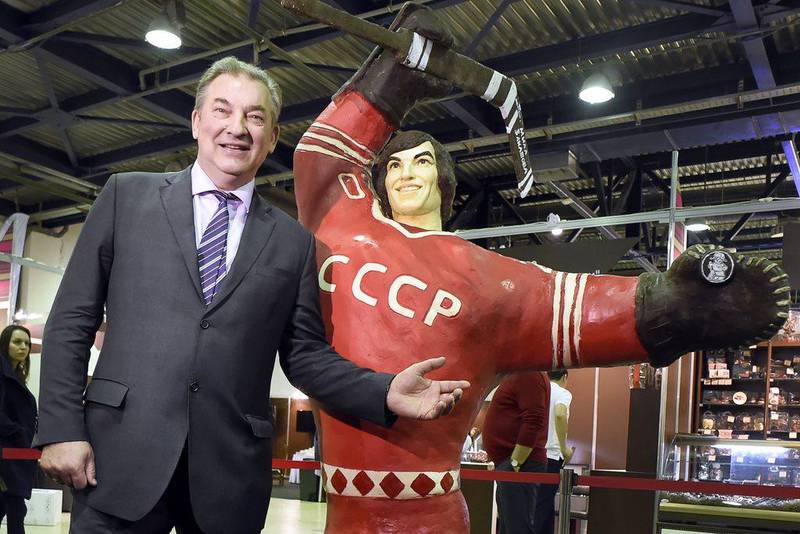 Soviet ice hockey legend Vladislav Tretiak poses next to his chocolate statue during the Salon du Chocolat opening night. Alexander Nemenov / AFP

