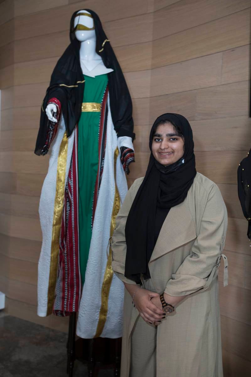 Design student Sauda Akhlad, 20, poses alongside her design.