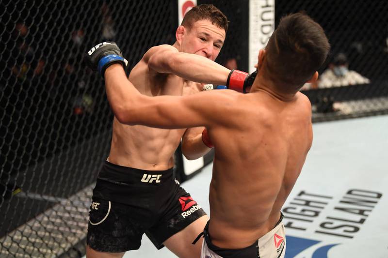 Kai Kara France punches Brandon Royval in their flyweight bout during UFC 253 in Abu Dhabi. Josh Hedges / Zuffa LLC