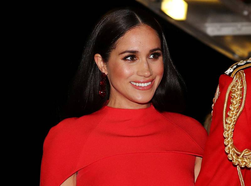 FILE - In this Saturday March 7, 2020 file photo, Meghan, Duchess of Sussex with Prince Harry arrives at the Royal Albert Hall in London, to attend the Mountbatten Festival of Music. A British newspaper doesnâ€™t have to run a front-page statement about the Duchess of Sussexâ€™s legal victory until it has had the chance to challenge the order, a judge ruled Monday March 22, 2021. (Simon Dawson/Pool via AP, File)
