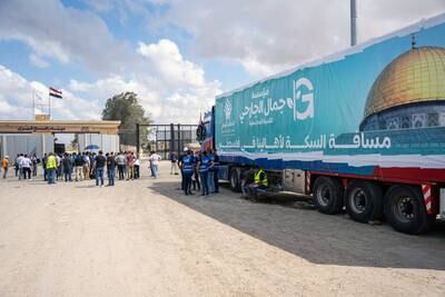 A truck from the humanitarian aid convoy is parked outside the Rafah border gate on Thursday. EPA