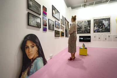 Dubai, United Arab Emirates - Reporter: Alexandra Chaves. Arts and Lifestyle. A visitor looks at the Athr Gallery booth. Art Dubai 2021 opens at the DIFC. Tuesday, March 30th, 2021. Dubai. Chris Whiteoak / The National