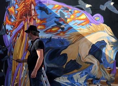 Artist Ruben Poncia, from the Netherlands, gives the final touch at the Dubai 3D Art Festival at the Dubai City Walk in Dubai. Satish Kumar / The National