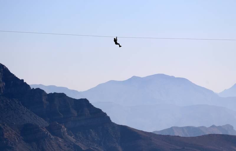Tackling the zip line at Jebel Jais, Ras Al Khaimah, on a misty New Year's Day. Chris Whiteoak / The National