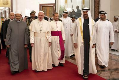 ABU DHABI, UNITED ARAB EMIRATES - February 3, 2019: Day one of the UAE Papal visit - HH Sheikh Mohamed bin Zayed Al Nahyan, Crown Prince of Abu Dhabi and Deputy Supreme Commander of the UAE Armed Forces (R), receives His Holiness Pope Francis, Head of the Catholic Church (2nd L) and His Eminence Dr Ahmad Al Tayyeb, Grand Imam of the Al Azhar Al Sharif (L), at the Presidential Airport. 

( Ryan Carter / Ministry of Presidential Affairs )
---