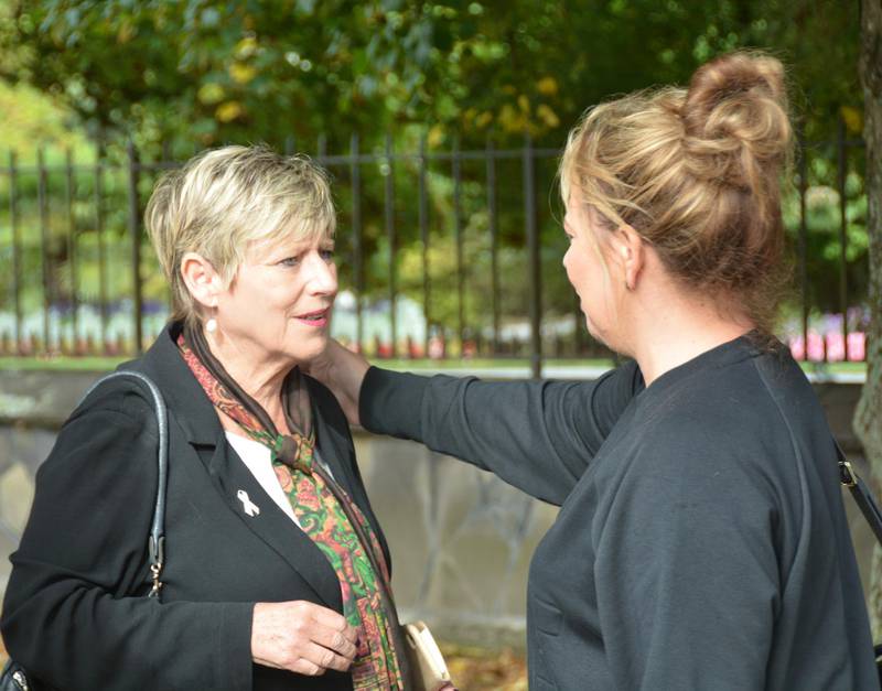 Christchurch Mayor Lianne Dalziel receives a show of support from a woman nearby the Rolleston Ave vigil. Steve Addison / The National 