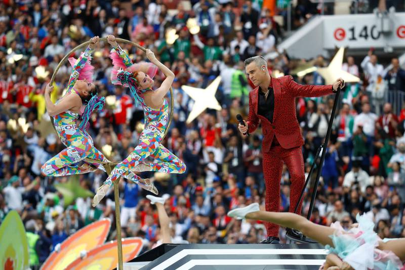 Robbie Williams performs during the opening ceremony. Kai Pfaffenbach / Reuters