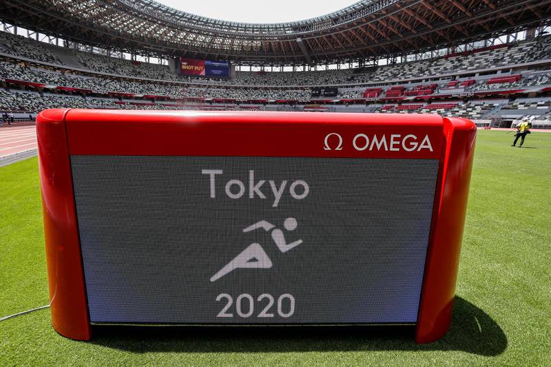The Tokyo 2020 athletics pictogram is seen on an electronic display during the morning session of the athletics test event. Reuters