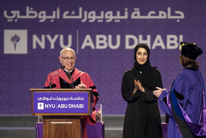 Shamma Al Mazrui, Minister of State for Youth, and Vice Chancellor Alfred Bloom announce the distinguished alumni award winner during a graduation ceremony. Christopher Pike / The National