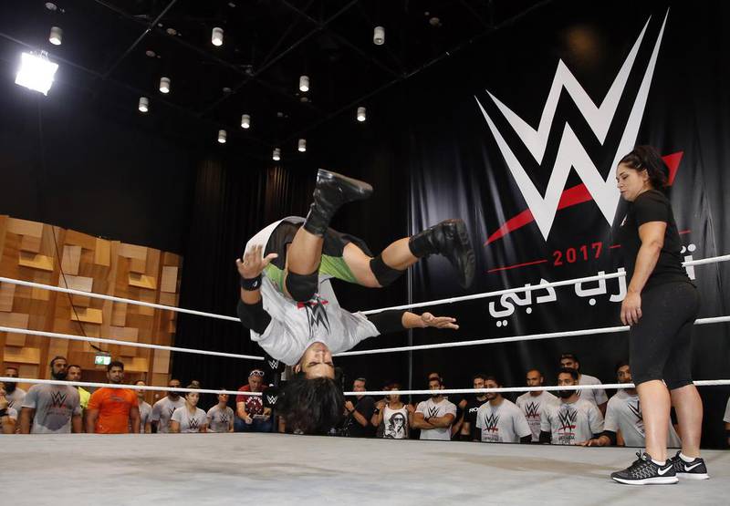 Wannabe wrestlers hoping for a chance to join the popular World Wrestling Entertainment franchise took to the ring in Dubai on Thursday. Here one of the 40 selected hopefuls shows off his moves at the WWE tryouts, which were held at Dubai Opera.  Chris Whiteoak for The National